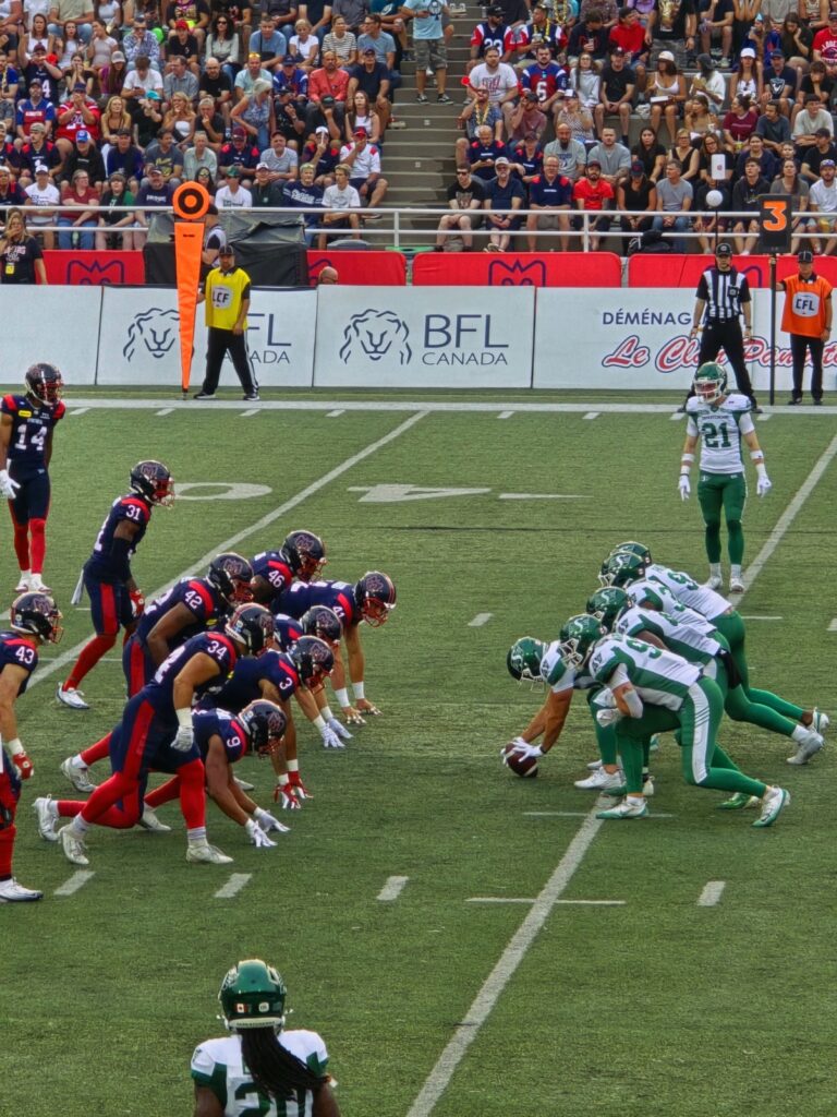 Players at a football game in Percival Molson stadium